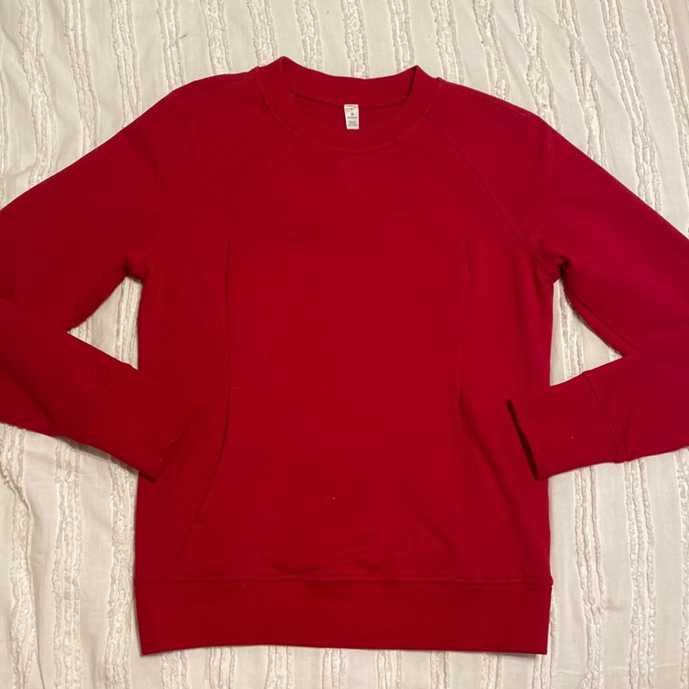 This is a red Lululemon Scuba Crewneck, size 4.